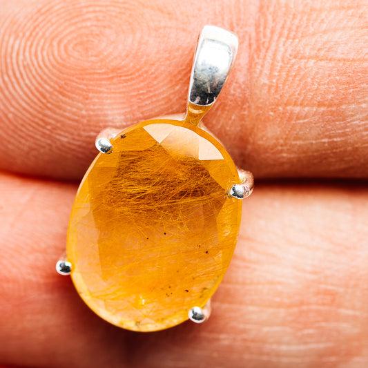 Oval orange rutilated quartz pendant with sterling silver prongs and bail
