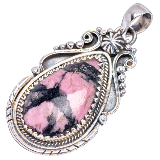Rhodonite pendant in .925 sterling silver with teardrop pink stone and ornate bezel.