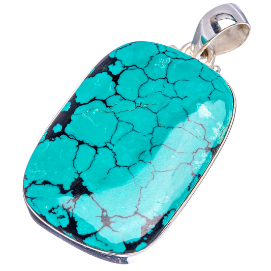 Oval turquoise stone pendant in sterling silver bezel with top bail
