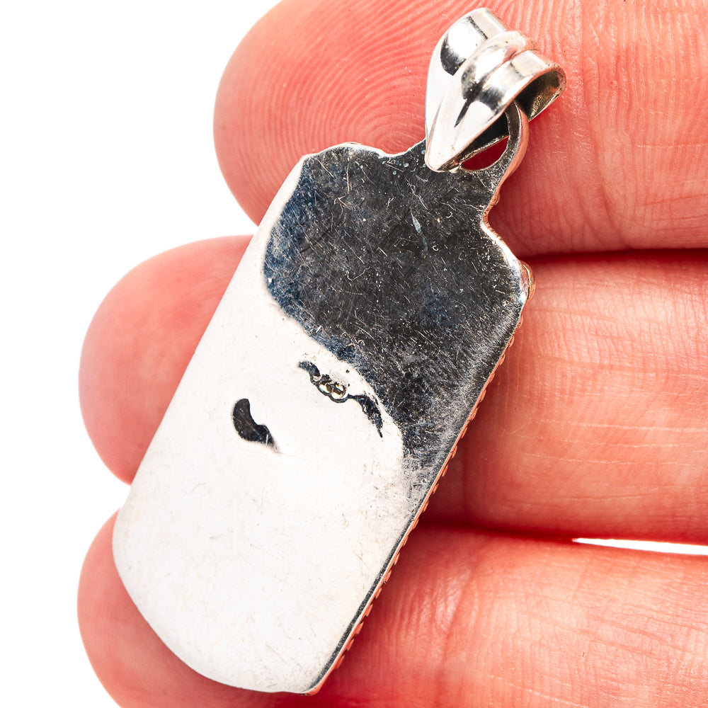 Back of .925 sterling silver turquoise pendant with bail loop and stamped texture