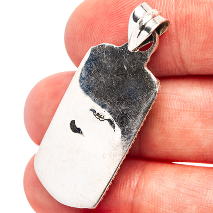 Back of .925 sterling silver turquoise pendant with bail loop and stamped texture