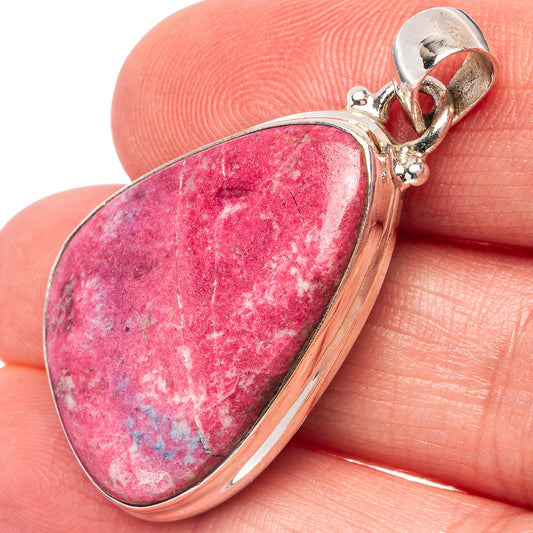 Sterling silver teardrop thulite pendant with pink and white stone, open bail.