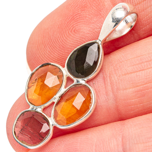 Faceted tourmaline pendant in .925 sterling silver bezel, with orange and pink stones