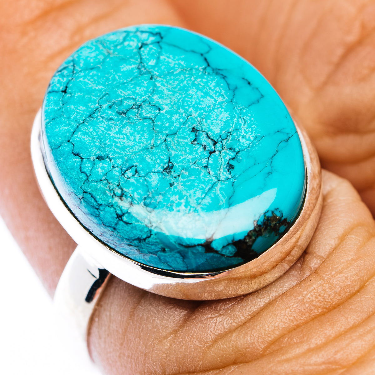 Turquoise oval cabochon ring in .925 sterling silver, close-up