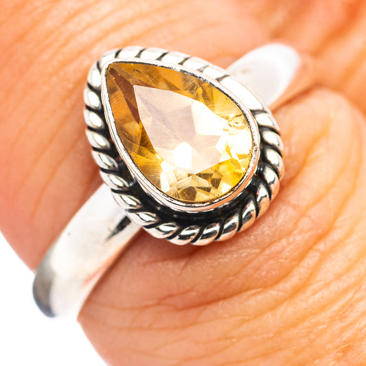 Sterling silver citrine ring with oval yellow gemstone, braided rope band