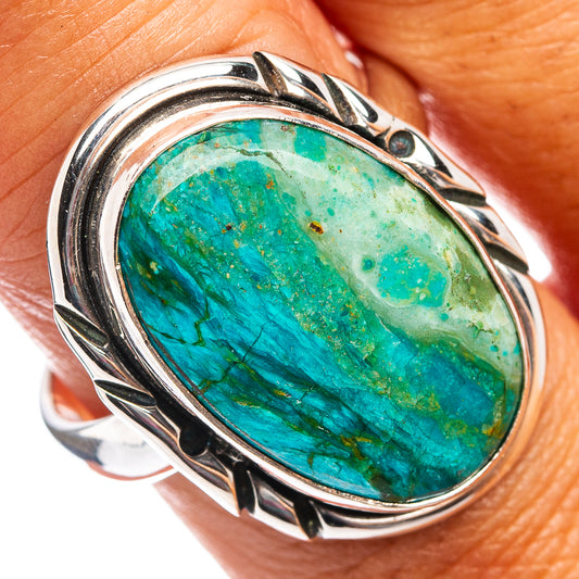 Turquoise opal oval cabochon set in sterling silver ring with ornate raised band