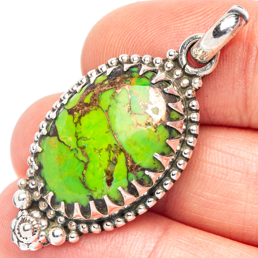 Green turquoise oval pendant with ornate 925 sterling silver bezel and bail