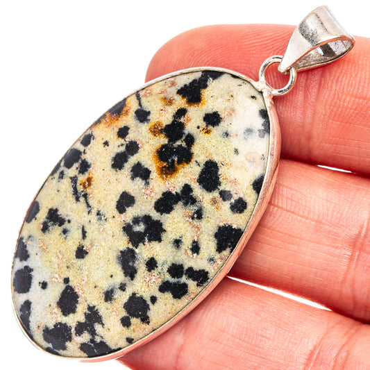 Dalmatian jasper pendant with oval stone and silver-plated bail, black speckled pattern