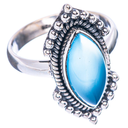 Sterling silver ring featuring oval blue stone, ornate beaded border and gallery