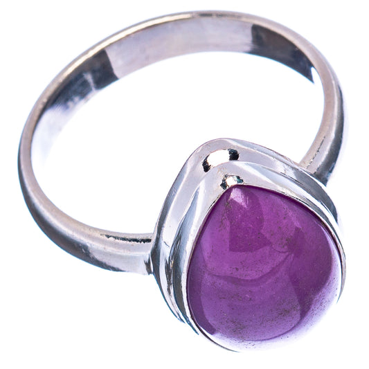 Sterling silver ring with purple oval cabochon stone and raised setting