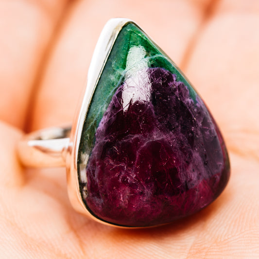 Sterling silver ring with a polished purple and green triangular gemstone, viewed from the front.