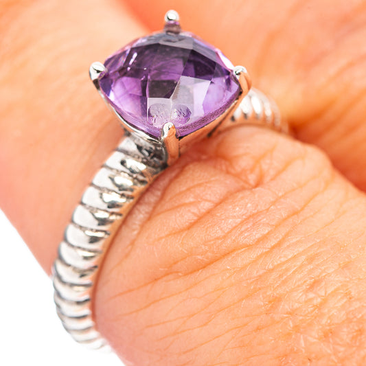 Sterling silver amethyst ring with purple faceted teardrop stone and prong setting
