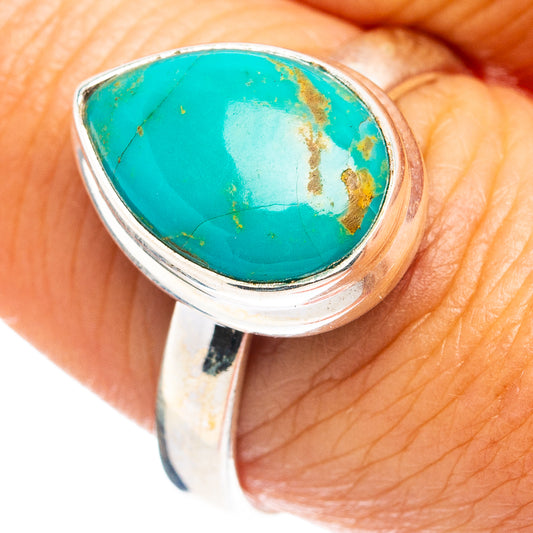 Sterling silver turquoise ring with oval cabochon and bezel setting