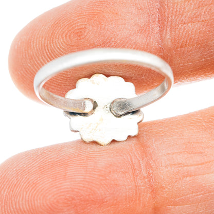 Sterling silver ring band with floral cutout design on underside