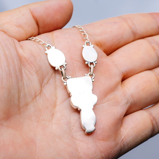 Sterling silver pendant necklace with pale teardrop stones and linked chain