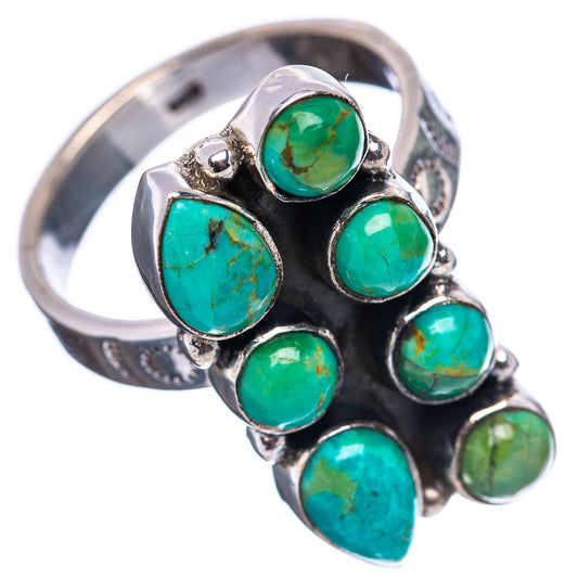 Turquoise oval gemstone ring with bezel-set stones on a wide sterling silver band