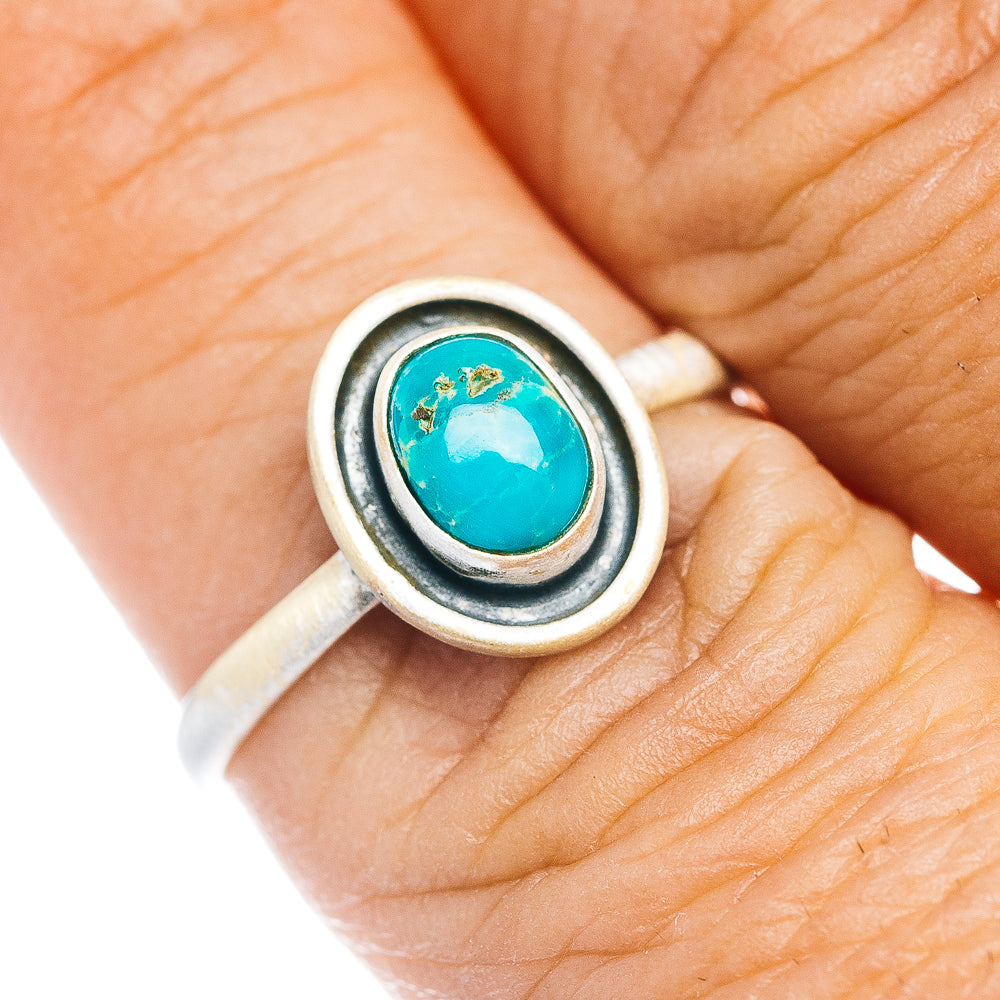 Sterling silver turquoise oval ring with raised bezel and dark border