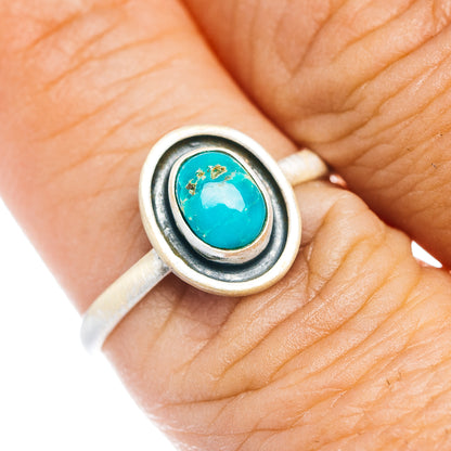 Sterling silver turquoise oval ring with raised bezel and dark border