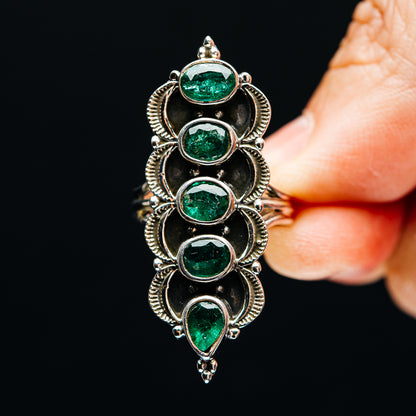 Sterling silver five-stone ring with oval green emeralds in raised halo bezels