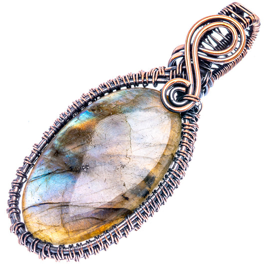 Oxidized copper wire-wrap labradorite teardrop pendant with blue and gold stone