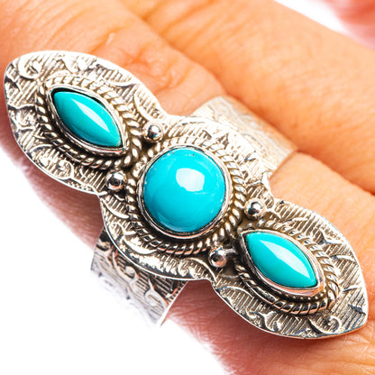 Large sterling silver turquoise ring with three oval cabochon stones, ornate bezel work