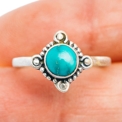 Turquoise oval cabochon sterling silver ring with openwork border and bead details