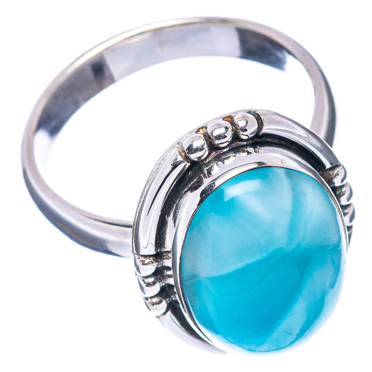 Sterling silver ring with oval blue larimar stone, curved bezel and prong details