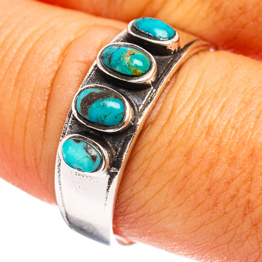 Turquoise inlay silver ring with four oval settings on a stacking cuff band