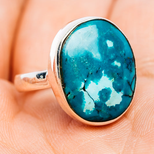Oval turquoise cabochon sterling silver ring with gold-toned bezel, side view