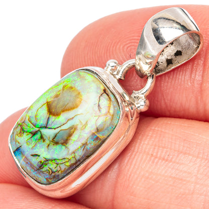 Sterling silver oval opal pendant with iridescent green-blue stone and open bail