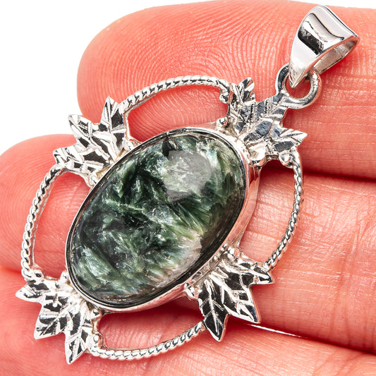 Oval green seraphinite pendant, .925 sterling silver setting with star-like accents
