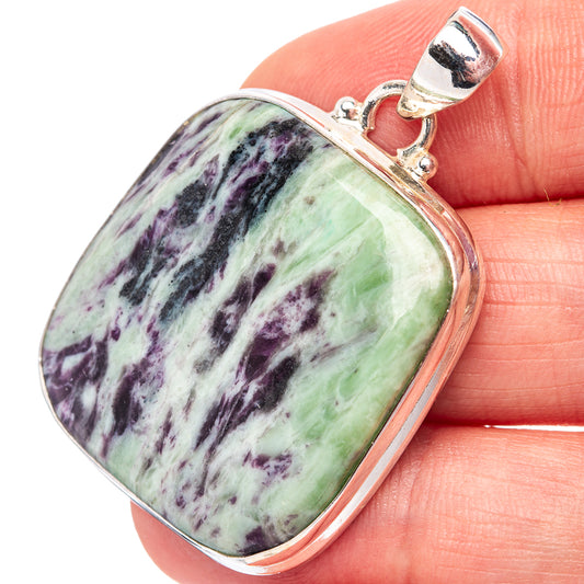 Sterling silver pendant with green and purple marbled oval gemstone, polished bezel