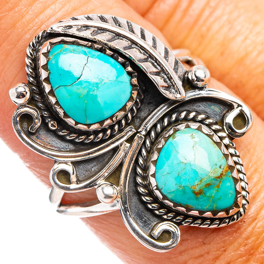 Turquoise gemstone ring in .925 sterling silver with oval turquoise stones and carved setting