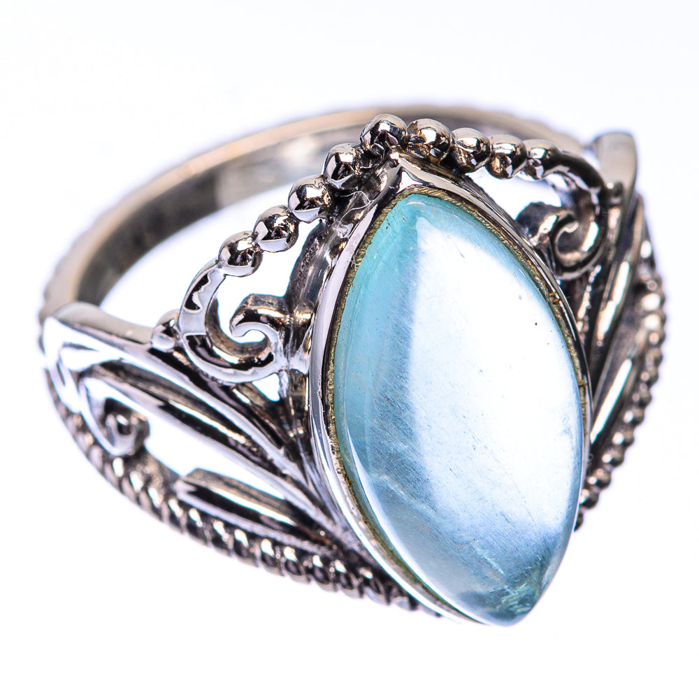 Sterling silver aquamarine ring, oval sky-blue gemstone with raised decorative mount