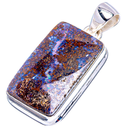 Rectangular boulder opal pendant in silver frame, blue and dark speckled stone