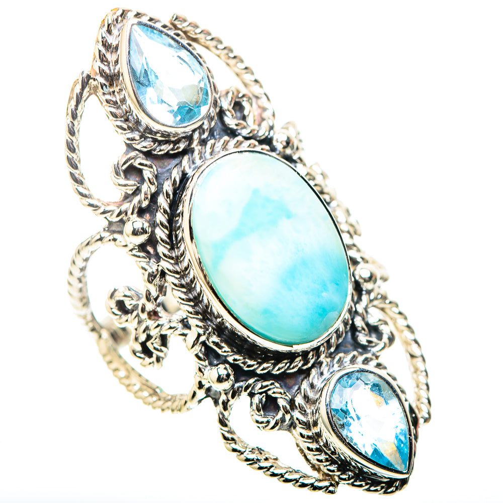 Sterling silver ring with oval turquoise center stone and two pear-cut blue stones