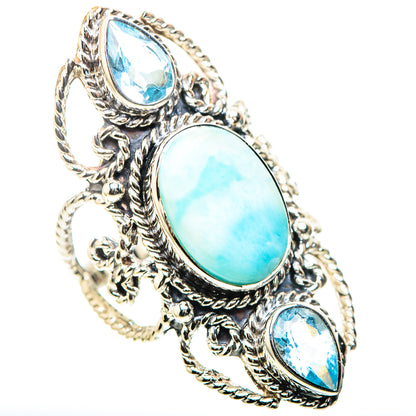Sterling silver ring with oval turquoise center stone and two pear-cut blue stones