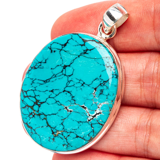 Turquoise oval pendant in .925 sterling silver, black matrix stone with bail loop