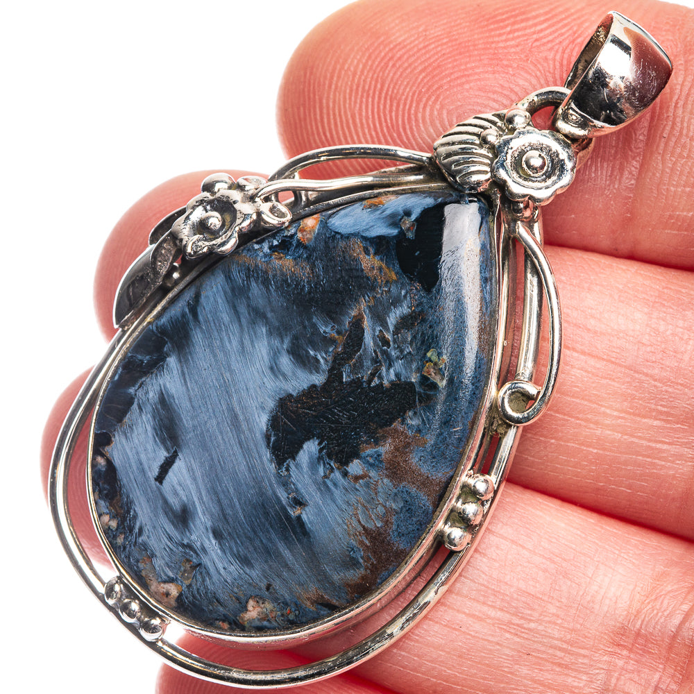 Sterling silver pietersite teardrop pendant with ornate wire frame and loop bail