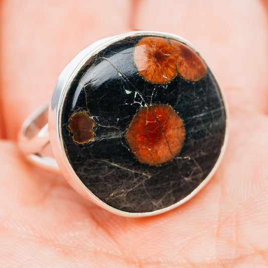 Sterling silver ring with round obsidian face, dark stone and orange-brown patches
