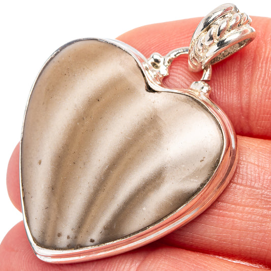 Heart-shaped sterling silver flint pendant with mottled gray stone, side bail
