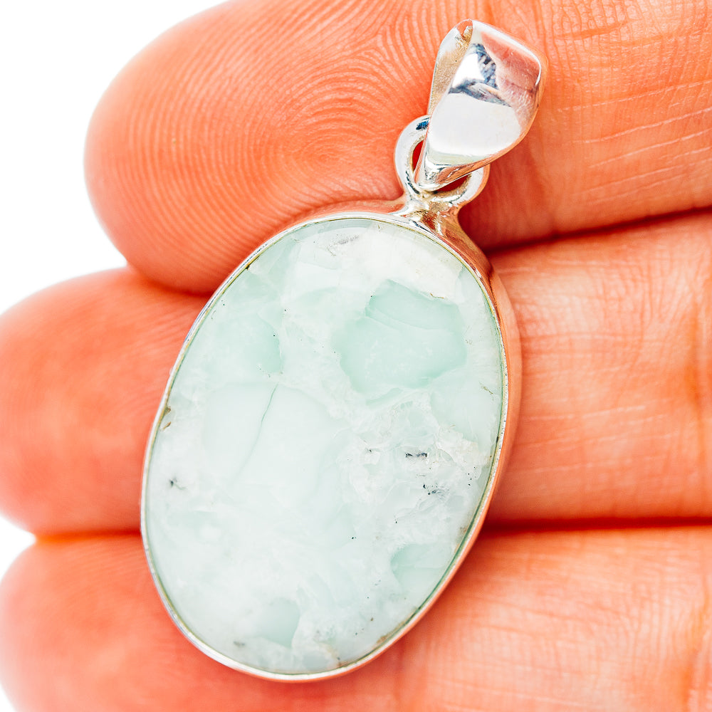 Oval light green aragonite pendant in .925 sterling silver bezel with loop bail