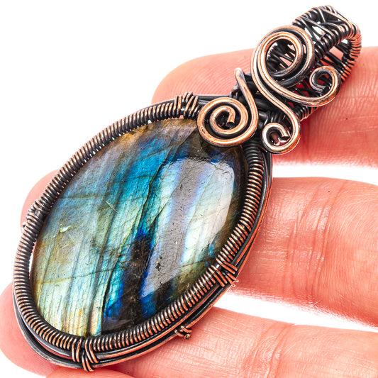 Labradorite wire wrap pendant, oval blue-green stone in oxidized copper