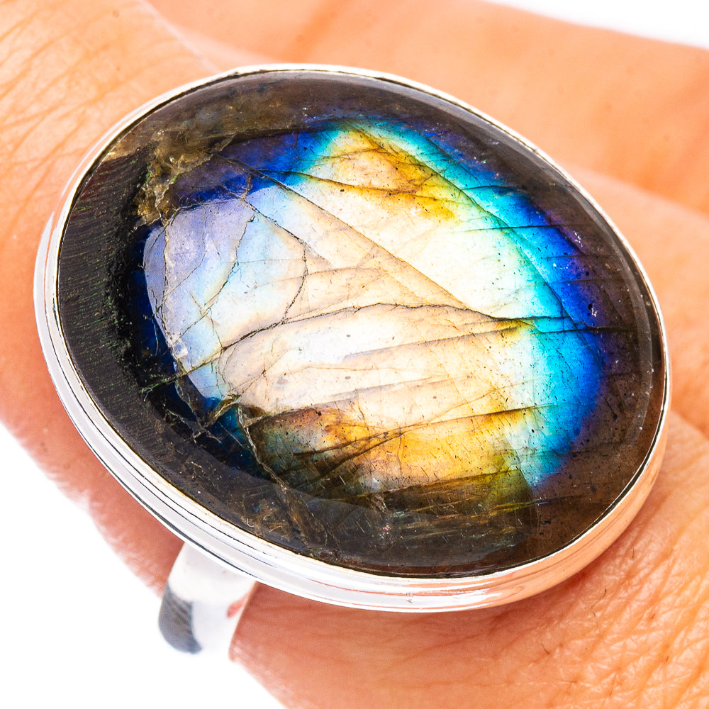 Sterling silver labradorite ring with oval gemstone showing blue flash in bezel