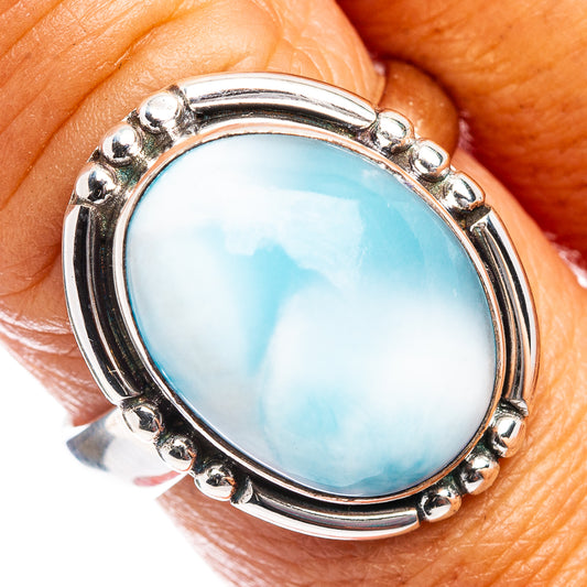 Oval Larimar cabochon sterling silver ring with raised bezel and small bead border