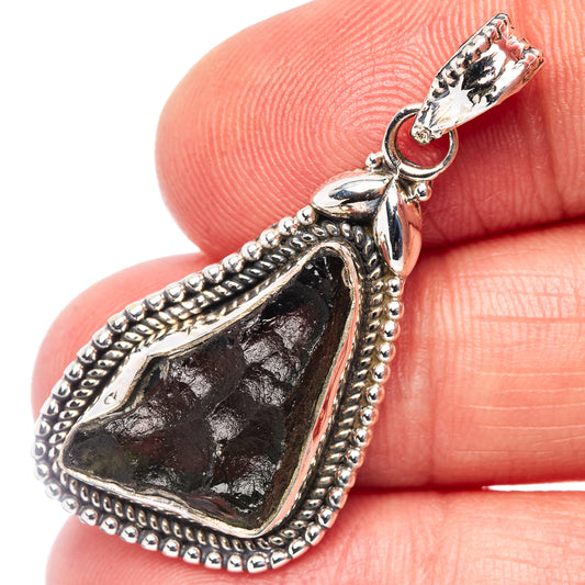 Sterling silver moldavite pendant, teardrop bezel with bead edge and jump ring bail.