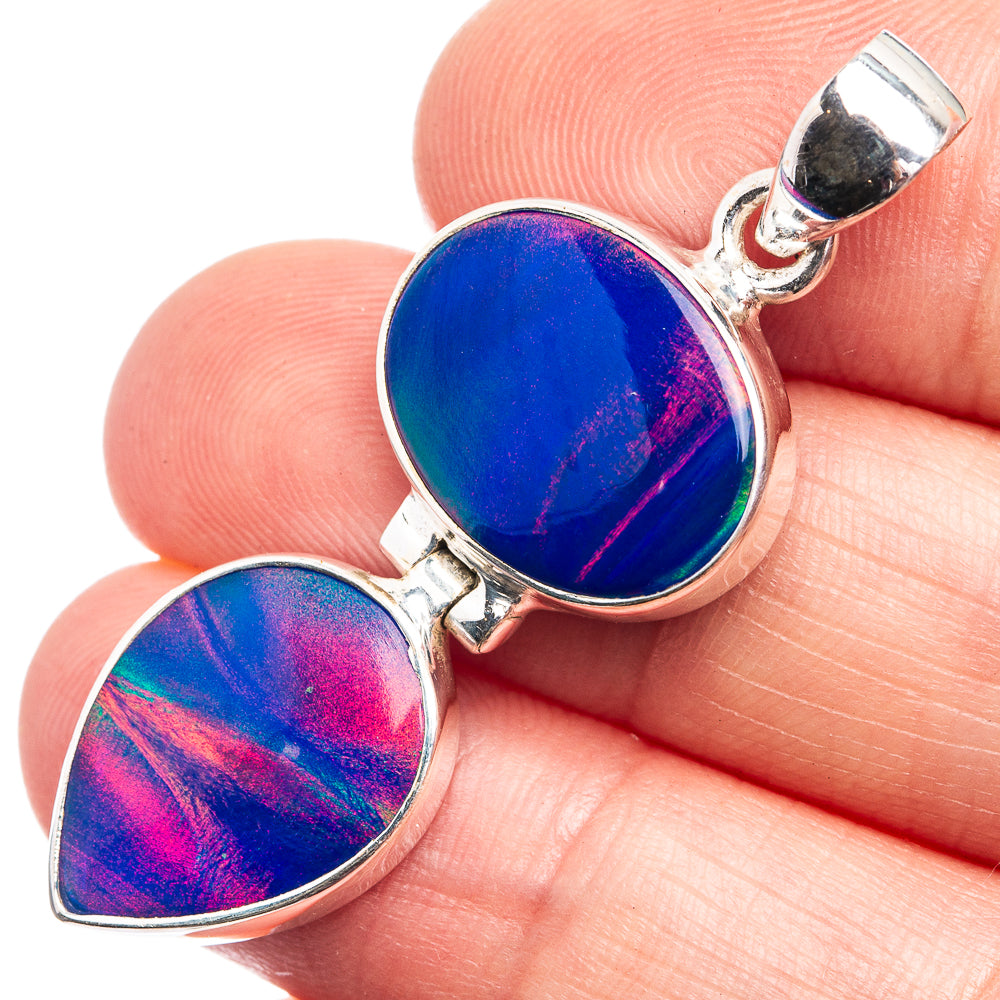 Two-stone sterling silver opal pendant with iridescent blue teardrop cabochons