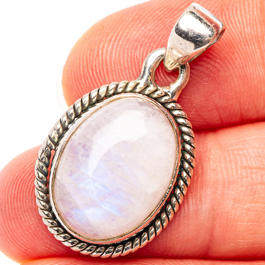 Oval rainbow moonstone cabochon pendant in .925 sterling silver with rope-edged frame