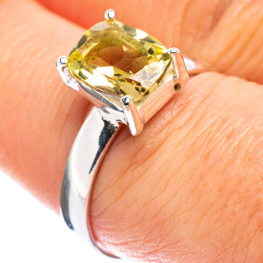 Sterling silver ring with large faceted yellow quartz center stone and four prongs