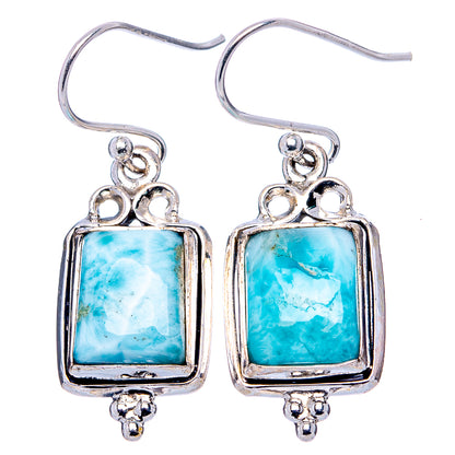 Sterling silver dangle earrings with square light-blue larimar stones and ornate frames